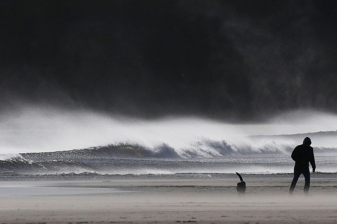 From The Times Newspaper, 3 October 2017: A man and his dog brave the winds that struck Tynemouth beach yesterday. OWEN HUMPHREYS/PA