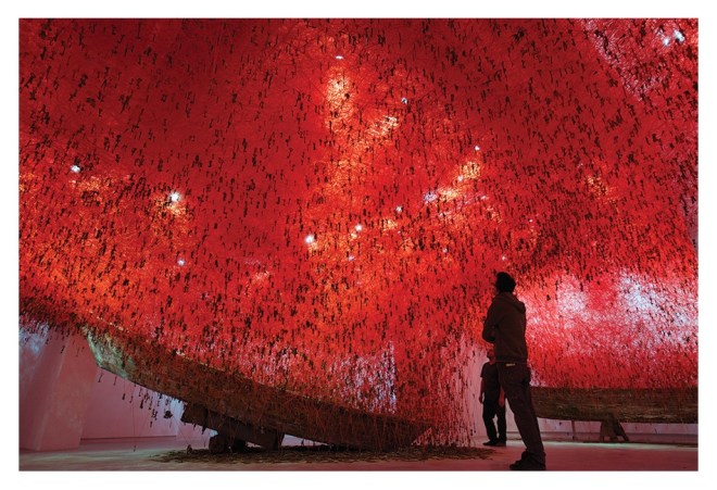 Chiharu Shiota: The Key in the Hand, 2015, old keys, old wooden boat, red yarn, dimensions variable. Japan Pavillion 56th Venice Biennale, Italy. Photo by Sunhi Mang. Courtesy of the Artist.